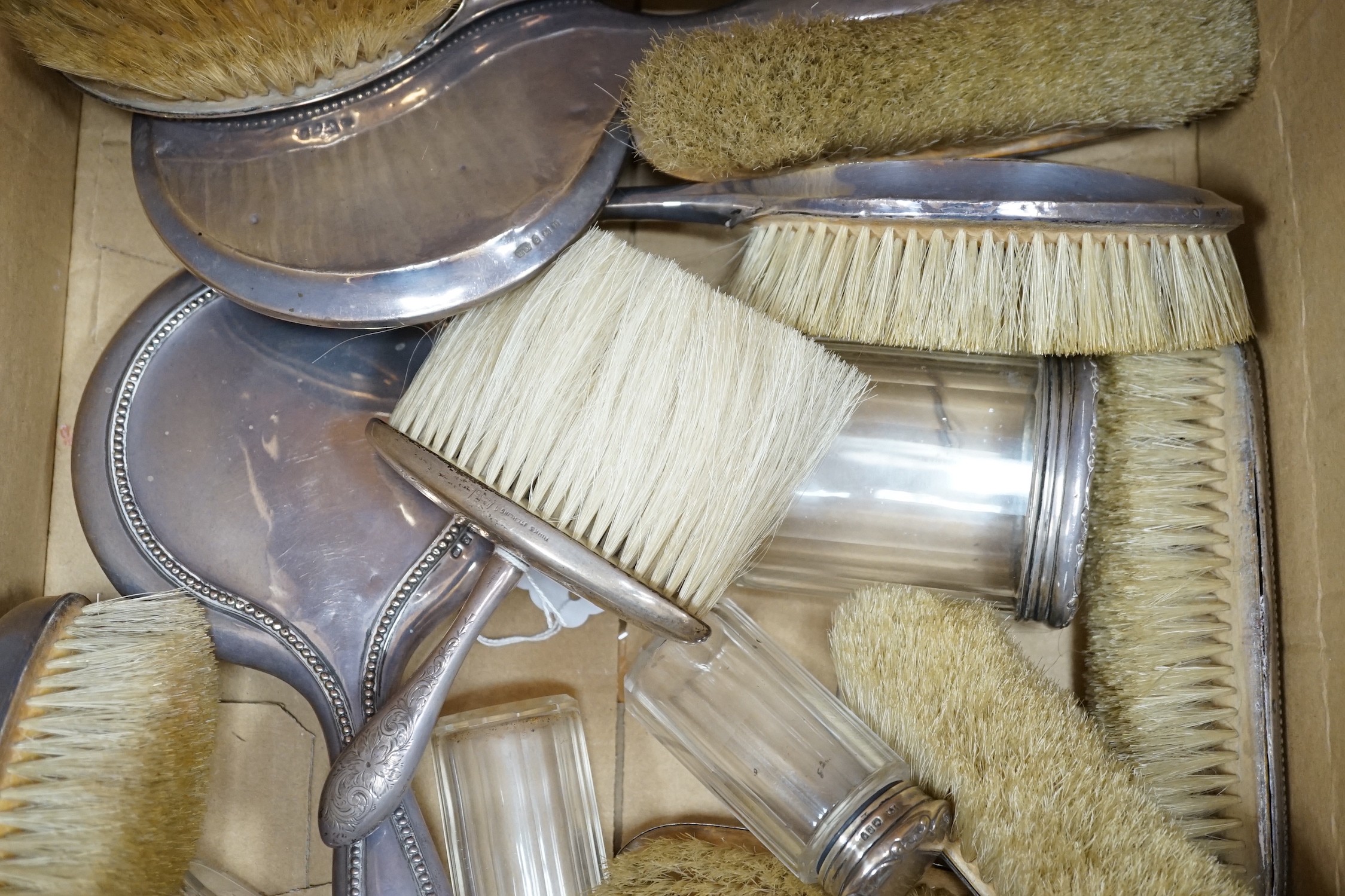 A quantity of assorted silver mounted hand mirrors, brushes and toilet jars, various dates and makers
